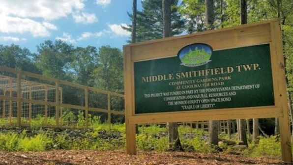 A sign about the Community Gardens